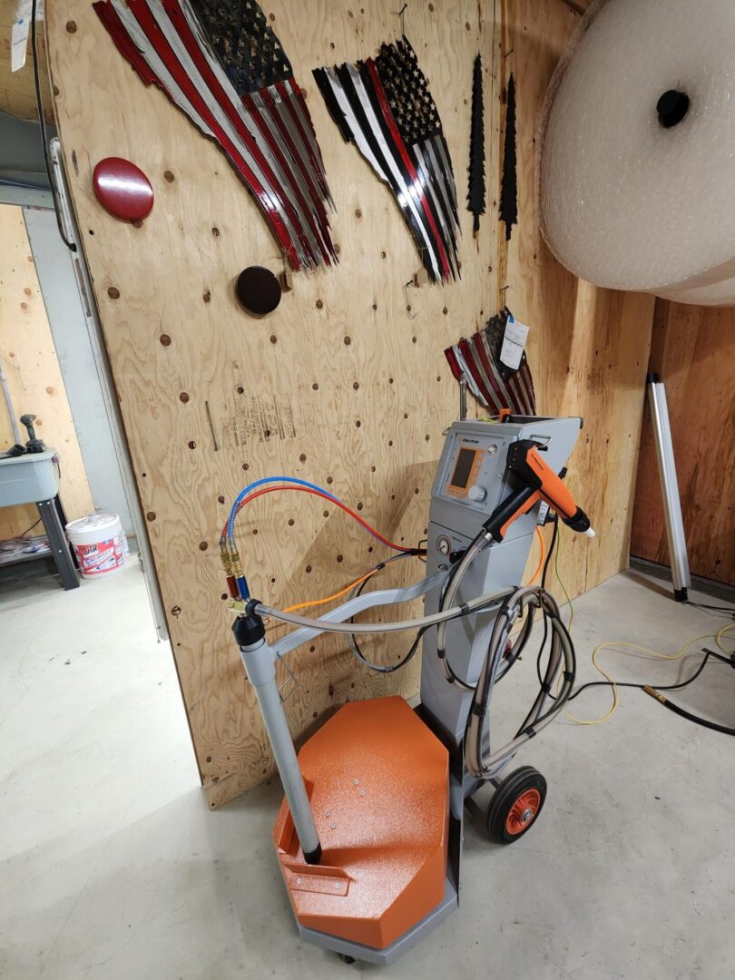 A tool cart with tools hanging on the wall.