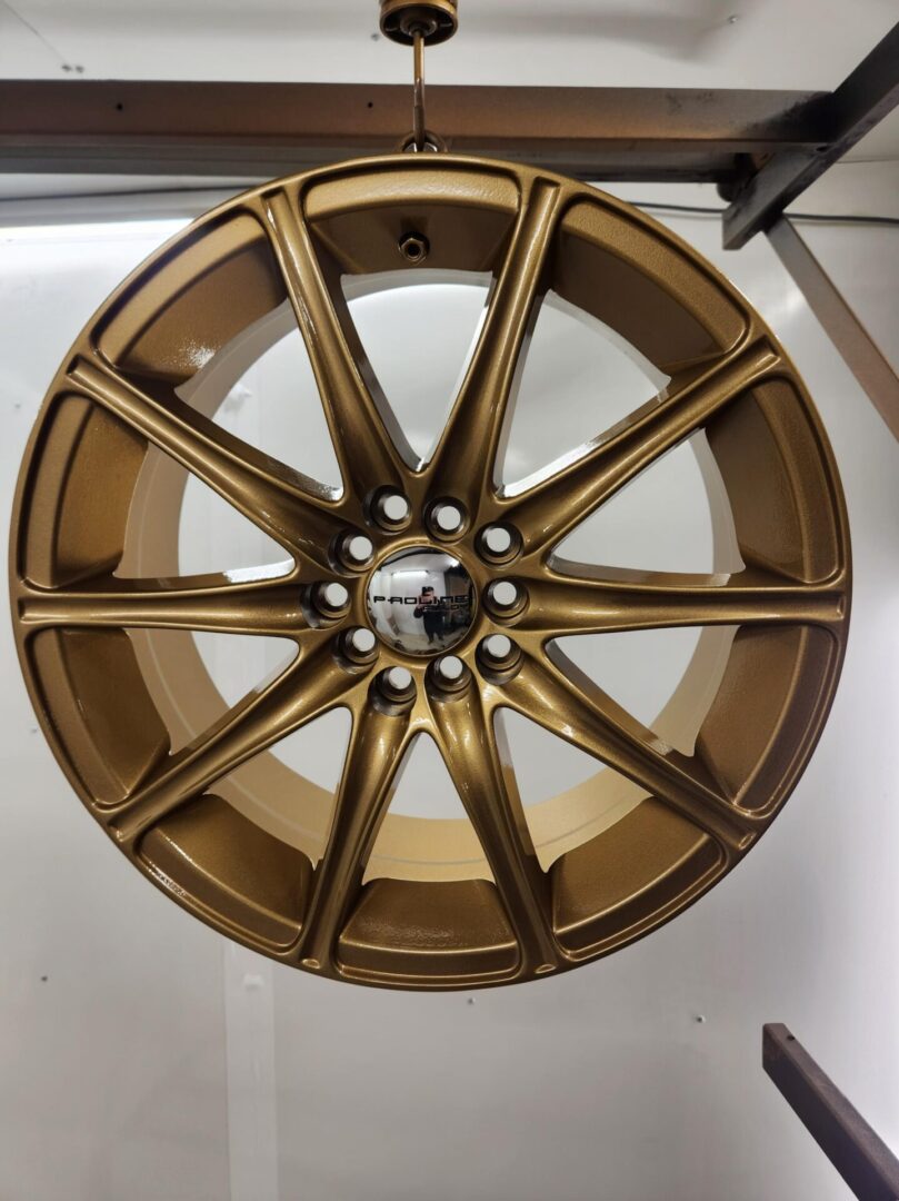 A gold rim with white wall in the background