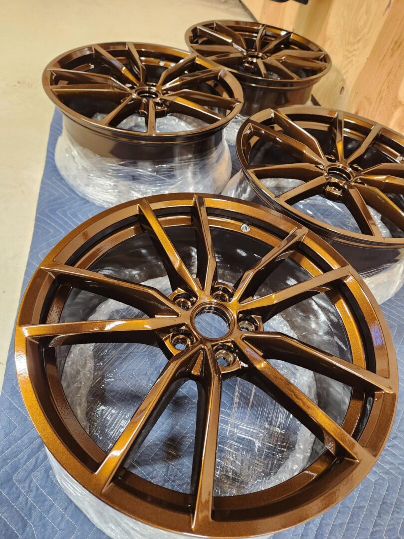 A group of four wheels that are sitting on top of plastic.