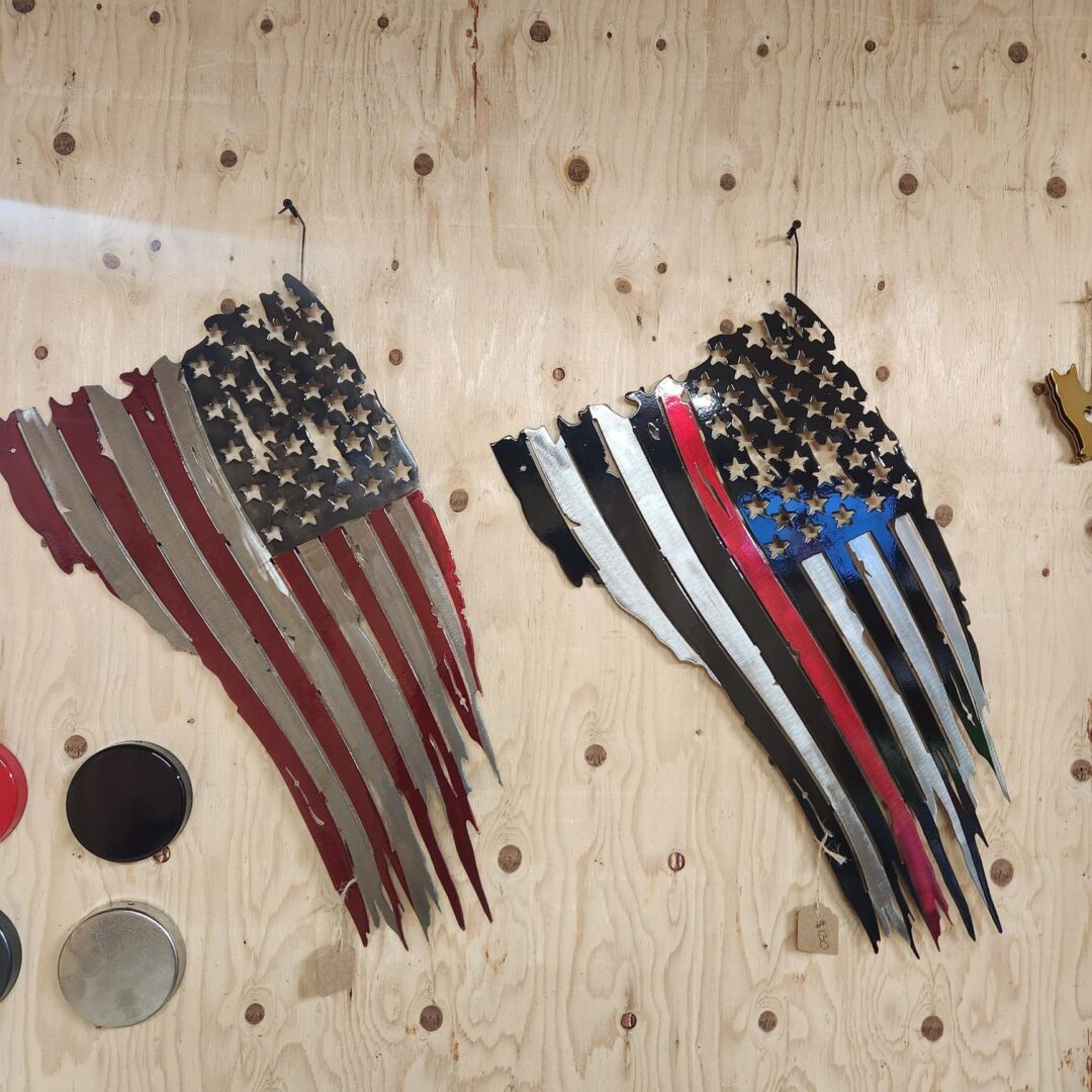 Two american flags are on a table.